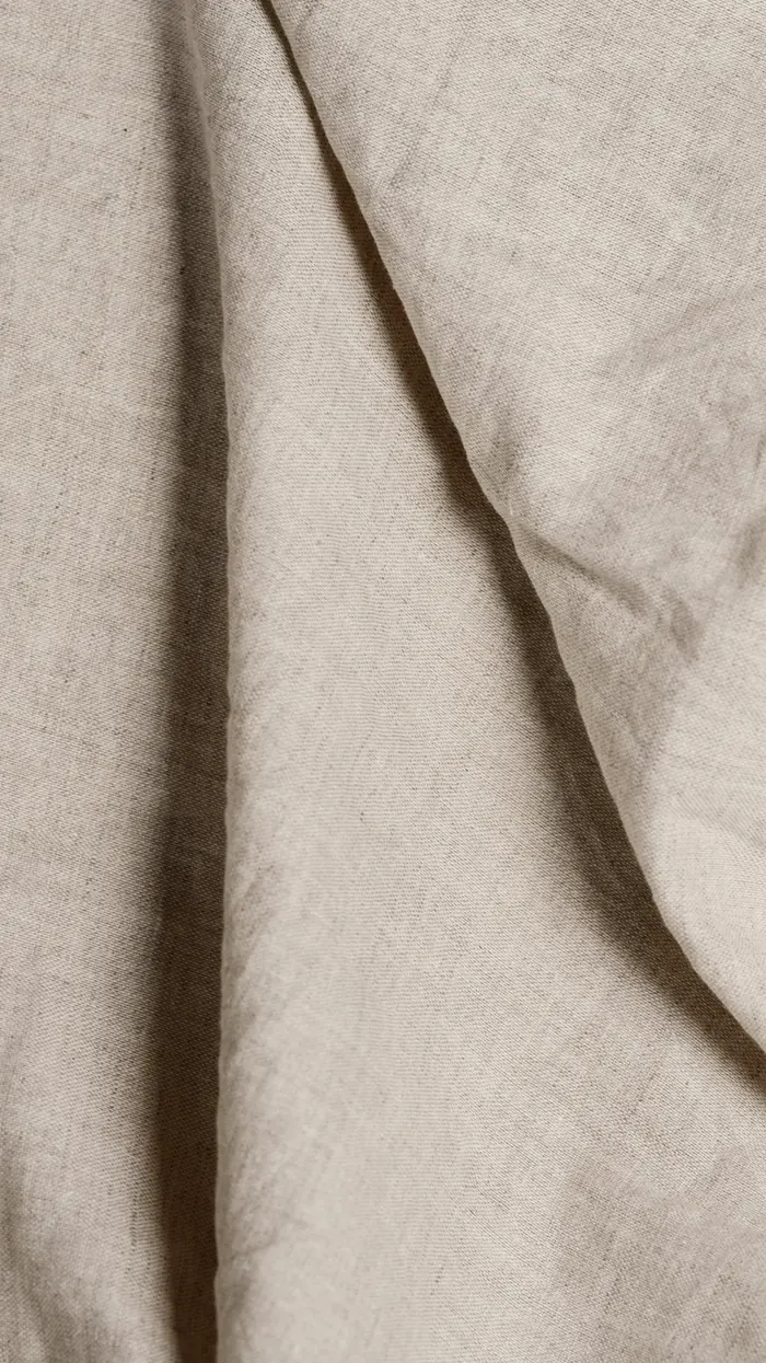 Undyed linen folded in soft light