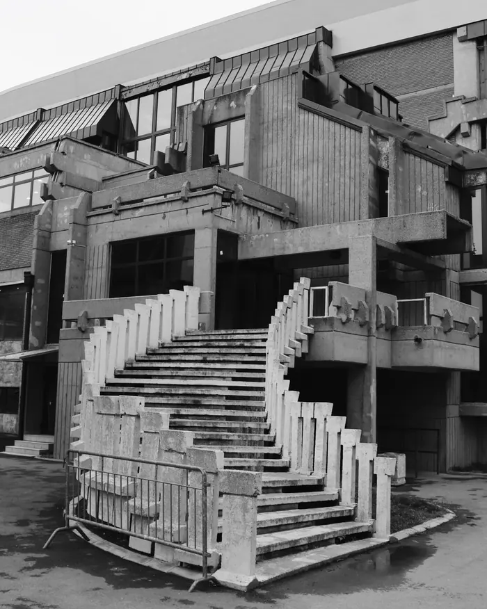 A cast concrete stair edge on a brutalist facade